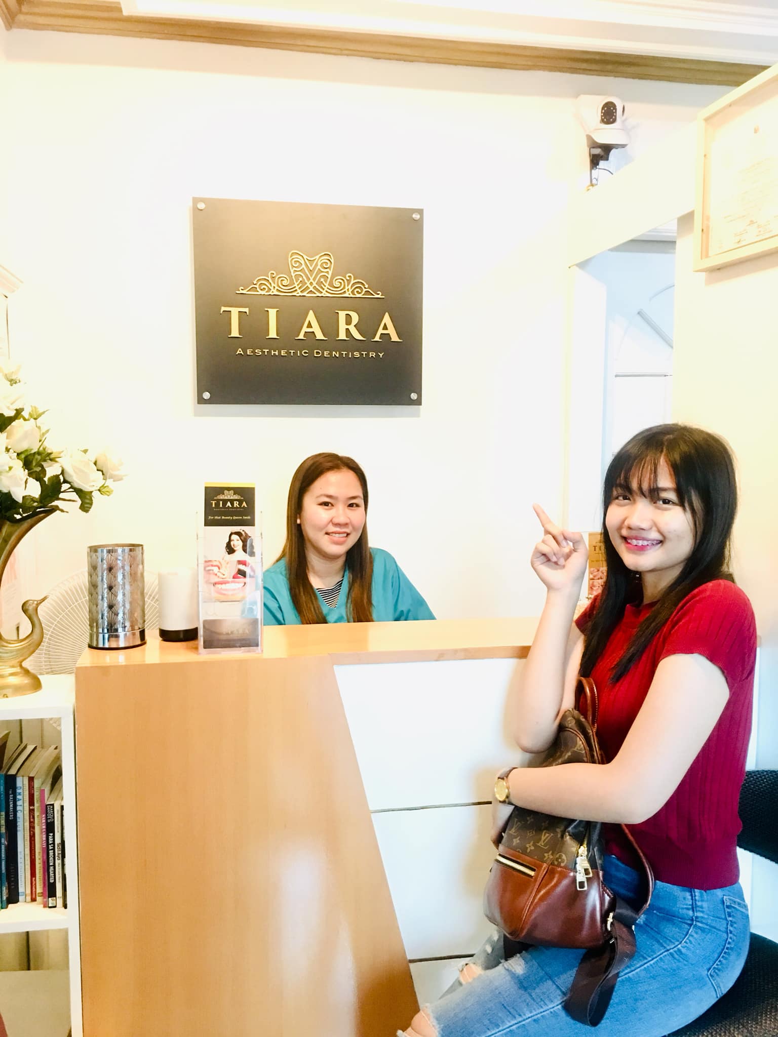 Patient at the reception of Tiara Dental Clinic in Cubao, Quezon City with the clinic team