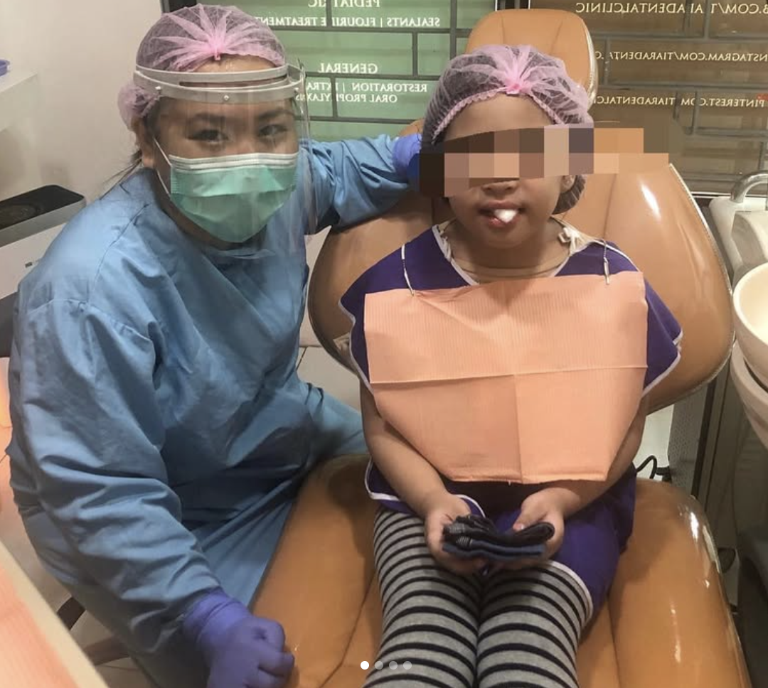 A young patient sitting calmly in the chair during a visit at Tiara Dental Clinic in Cubao, Quezon City. The face is obscured for privacy.